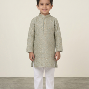 Young boy wearing sage green embroidered kurta with white pajama pants