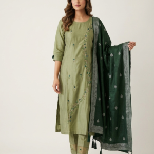Woman wearing an elegant olive green embroidered kurta set with matching pants and a dark green dupatta featuring silver woven detailing and tassel accents, styled for festive and traditional occasions.