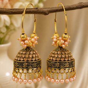 Gold jhumka earrings with peach pearl beads and intricate traditional design